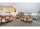 Large community room with tables and chairs, perfect for gatherings at 1215 Dustan Pl, Trinity, FL 34655