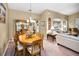 Formal dining room featuring a wood table, chairs, and a china cabinet at 1215 Dustan Pl, Trinity, FL 34655