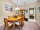 Formal dining room featuring a wood table, chairs, and a china cabinet at 1215 Dustan Pl, Trinity, FL 34655