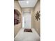 Bright and airy entryway with tile flooring and a decorative wall accent at 1215 Dustan Pl, Trinity, FL 34655