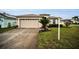 Single-story home with attached garage and well-manicured lawn at 1215 Dustan Pl, Trinity, FL 34655