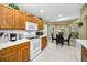 Bright kitchen with ample cabinetry, breakfast nook, and modern appliances at 1215 Dustan Pl, Trinity, FL 34655