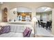 Kitchen with light wood cabinets, white appliances, and a breakfast nook at 1215 Dustan Pl, Trinity, FL 34655