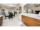 Kitchen features a breakfast bar, and a dining area with a view of the backyard at 1215 Dustan Pl, Trinity, FL 34655
