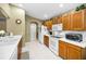 Well-equipped kitchen with ample counter space and wood cabinets at 1215 Dustan Pl, Trinity, FL 34655