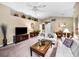 Spacious living room with comfortable seating and a large TV at 1215 Dustan Pl, Trinity, FL 34655