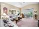 Open concept living room with views into the kitchen and dining area at 1215 Dustan Pl, Trinity, FL 34655