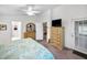Main bedroom with king bed, dresser, and access to the ensuite bathroom at 1215 Dustan Pl, Trinity, FL 34655