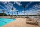 Resort-style pool with ample lounge chairs and lake views at 1215 Dustan Pl, Trinity, FL 34655