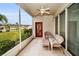Enjoyable screened-in porch with wicker furniture at 1215 Dustan Pl, Trinity, FL 34655