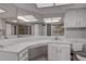 Bathroom with a large vanity and hexagon tile floor at 12430 81St Pl, Seminole, FL 33772