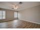 Bright bedroom with plantation shutters, ceiling fan and wood-look floors at 12430 81St Pl, Seminole, FL 33772