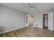 Bedroom with wood flooring and access to bathroom at 12430 81St Pl, Seminole, FL 33772