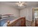Bedroom with wood bed frame and ceiling fan at 12430 81St Pl, Seminole, FL 33772