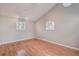 Simple bedroom with hardwood floors and two windows at 12430 81St Pl, Seminole, FL 33772