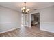 Dining room with chandelier and access to back patio at 12430 81St Pl, Seminole, FL 33772