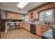Eat-in kitchen with light wood cabinets and breakfast bar at 12430 81St Pl, Seminole, FL 33772
