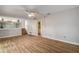 Living area with wood-look floors, built-in shelving, and access to bathroom at 12430 81St Pl, Seminole, FL 33772