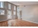 Bright living room with hardwood floors and sliding glass doors leading to a patio at 12430 81St Pl, Seminole, FL 33772