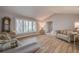 Spacious living room with vaulted ceilings and wood flooring at 12430 81St Pl, Seminole, FL 33772