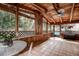 Relaxing screened porch with tile floor and backyard view at 12430 81St Pl, Seminole, FL 33772