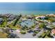 Aerial view of waterfront community with tennis court at 1308 Alhambra Dr, Apollo Beach, FL 33572