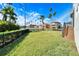 Spacious backyard with water view and palm trees at 1308 Alhambra Dr, Apollo Beach, FL 33572