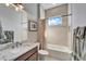 Bathroom with tub, shower, granite vanity and window at 1308 Alhambra Dr, Apollo Beach, FL 33572