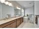 Elegant bathroom with double vanity, soaking tub, and walk-in shower at 1308 Alhambra Dr, Apollo Beach, FL 33572