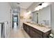 Double vanity bathroom with granite countertops and modern fixtures at 1308 Alhambra Dr, Apollo Beach, FL 33572