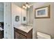Small bathroom with granite vanity and updated fixtures at 1308 Alhambra Dr, Apollo Beach, FL 33572