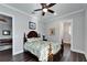 Bedroom with a queen bed, walk-in closet and ceiling fan at 1308 Alhambra Dr, Apollo Beach, FL 33572
