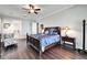 Spacious bedroom with dark wood furniture and a ceiling fan at 1308 Alhambra Dr, Apollo Beach, FL 33572