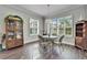 Bright dining room with wood floors and a charming table setting at 1308 Alhambra Dr, Apollo Beach, FL 33572