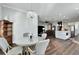 Open dining area with a glass-top table and view into the kitchen at 1308 Alhambra Dr, Apollo Beach, FL 33572
