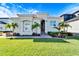 Mediterranean-style home with lush landscaping and welcoming entrance at 1308 Alhambra Dr, Apollo Beach, FL 33572