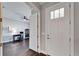 Long hallway with wood floors and access to rooms at 1308 Alhambra Dr, Apollo Beach, FL 33572
