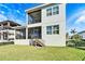 Two story house with screened in balcony at 1308 Alhambra Dr, Apollo Beach, FL 33572