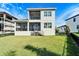 Two story house with screened in balcony at 1308 Alhambra Dr, Apollo Beach, FL 33572