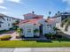 Two-story house with a red tile roof, white columns, and lush landscaping at 1308 Alhambra Dr, Apollo Beach, FL 33572