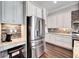 Bright kitchen with stainless steel refrigerator and built-in workspace at 1308 Alhambra Dr, Apollo Beach, FL 33572