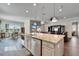Island kitchen with granite countertops and stainless steel appliances at 1308 Alhambra Dr, Apollo Beach, FL 33572