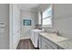 Convenient laundry room with washer, dryer, and utility sink at 1308 Alhambra Dr, Apollo Beach, FL 33572