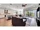 Open-concept living space with kitchen views and access to a patio at 1308 Alhambra Dr, Apollo Beach, FL 33572