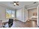 Home office with wood floors and large window with shutters at 1308 Alhambra Dr, Apollo Beach, FL 33572