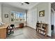 Bright office with hardwood floors and built-in shelving at 1308 Alhambra Dr, Apollo Beach, FL 33572