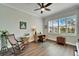 Home office features hardwood floors and large windows at 1308 Alhambra Dr, Apollo Beach, FL 33572