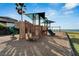playground with slides, swings, and shade structures at 1308 Alhambra Dr, Apollo Beach, FL 33572