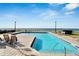 Relaxing community pool area with ocean views and lounge chairs at 1308 Alhambra Dr, Apollo Beach, FL 33572