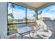 Relaxing screened balcony overlooking a tranquil lake and lush landscape at 1308 Alhambra Dr, Apollo Beach, FL 33572